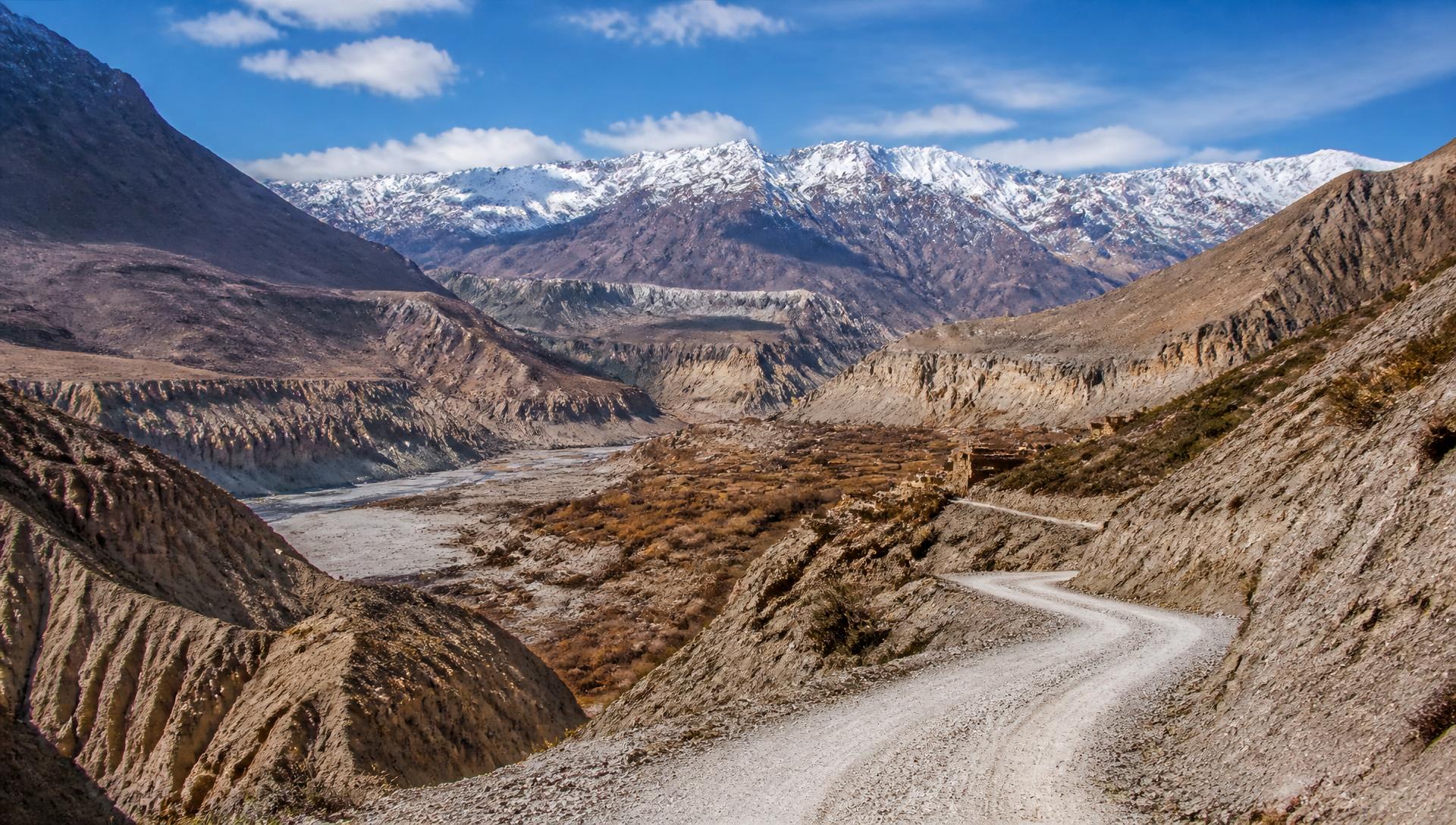 Winding mountain road through the arid canyons of Mustang, Nepal